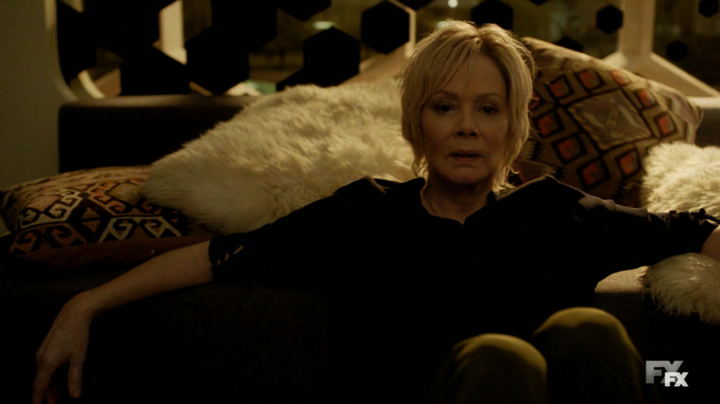 Melanie usually sits or smokes—often both at the same time.